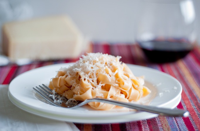 homemade red pasta with grated parmesan