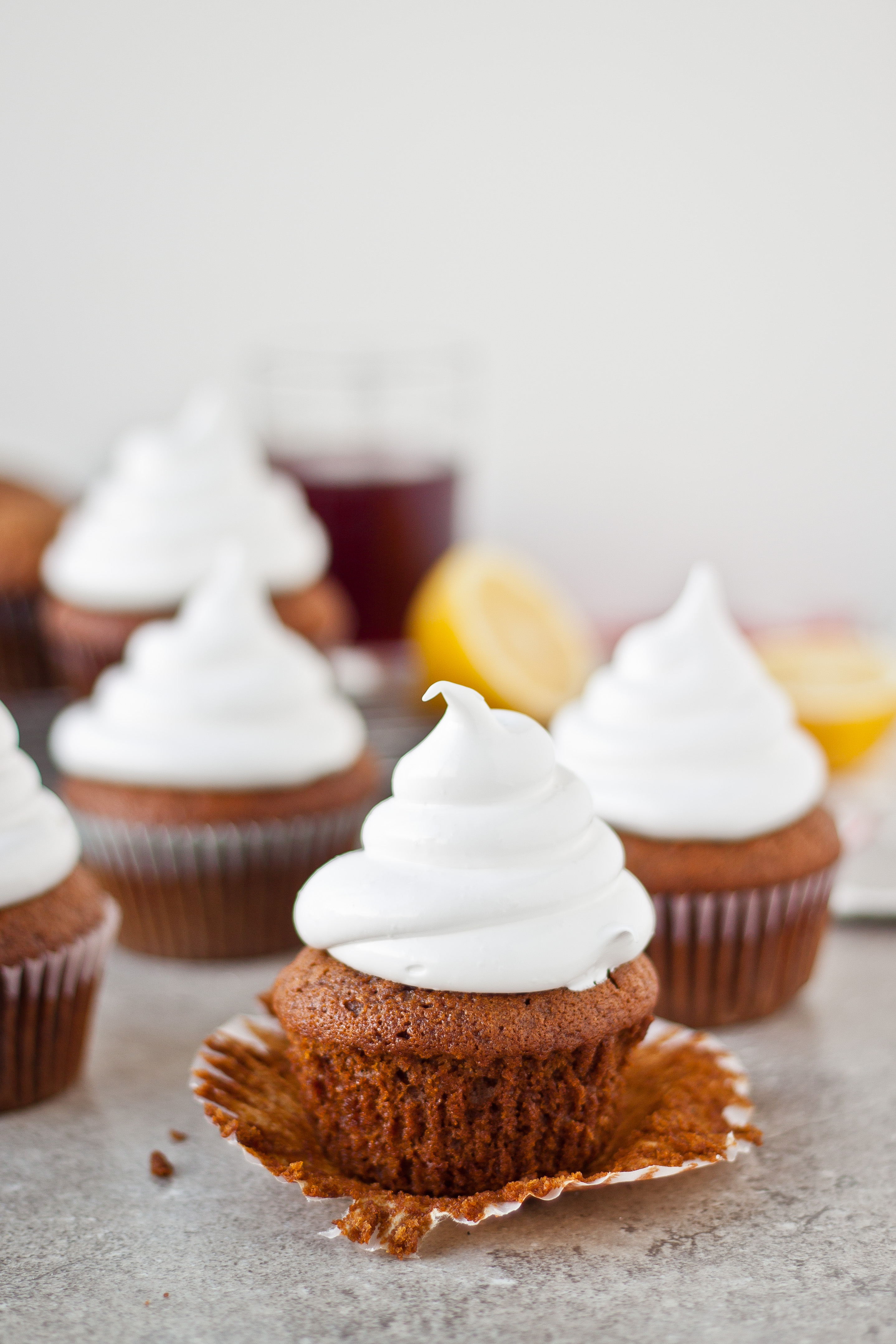 Gingerbread Cupcakes with Marshmallow Frosting and Pomegranate Caramel