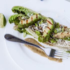 Grilled Romaine Salad with Avocado, Tomatillos, and Cotija Cheese