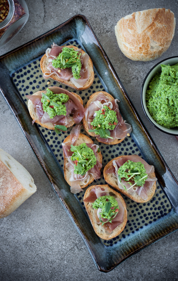 Pea Pesto Crostini with Prosciutto on Ceramic Tray