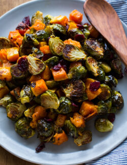 Roasted Brussels Sprouts and Squash with Dried Cranberries and Dijon Vinaigrette -- the perfect side dish for #Thanksgiving!