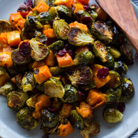 Roasted Brussels Sprouts and Squash with Dried Cranberries and Dijon Vinaigrette -- the perfect side dish for #Thanksgiving!