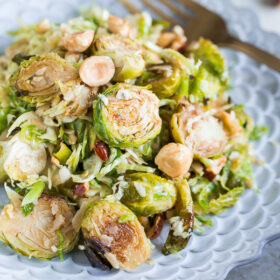 Brussels Sprouts Salad with Hazelnuts Parmesan and Pomegranate Molasses Vinaigrette