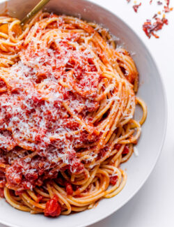 Classic Spaghetti All'Amatriciana. Homemade tomato sauce with pancetta, onion, garlic, and red pepper flakes!