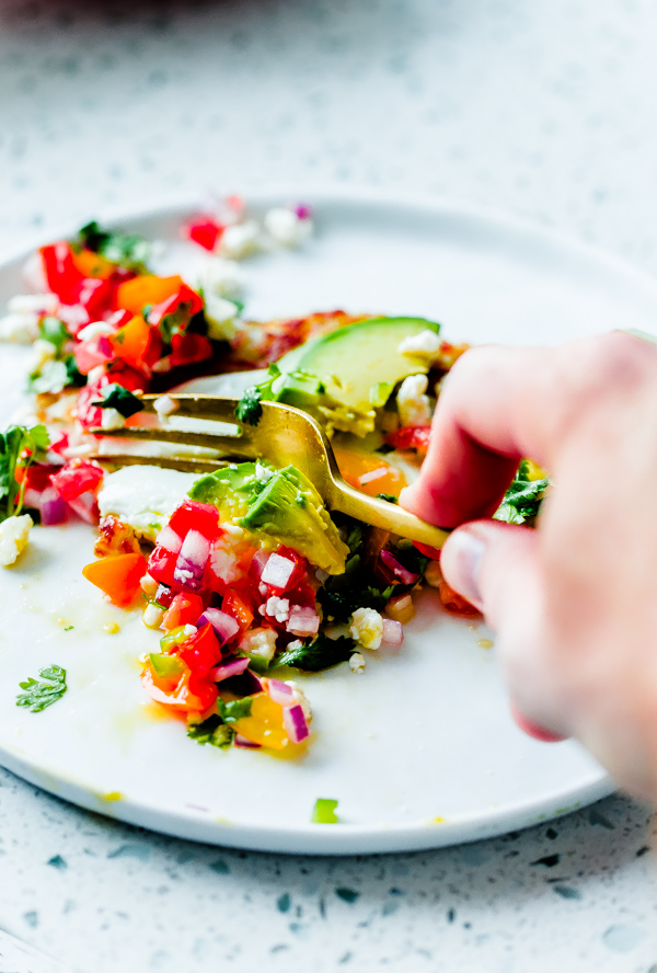 Mexican Hash Brown Stack. Crispy potato topped with sunny-side eggs, sliced avocado, homemade pico de gallo, and crumbled queso fresco cheese! 