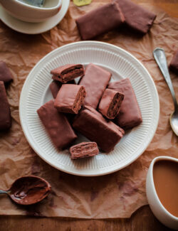 Homemade Tim Tams. Chocolate cookies filled with malt chocolate buttercream and dipped in milk chocolate!