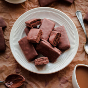 Homemade Tim Tams. Chocolate cookies filled with malt chocolate buttercream and dipped in milk chocolate!