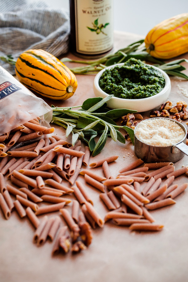 Whole Wheat Pasta with Walnut-Sage Pesto and Roasted Delicata Squash. A delicious, healthy, and EASY fall vegetarian pasta recipe!