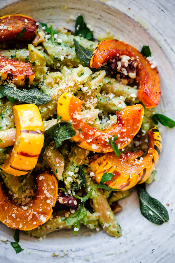 Whole Wheat Pasta with Walnut-Sage Pesto and Roasted Delicata Squash. A delicious, healthy, and EASY fall vegetarian pasta recipe!