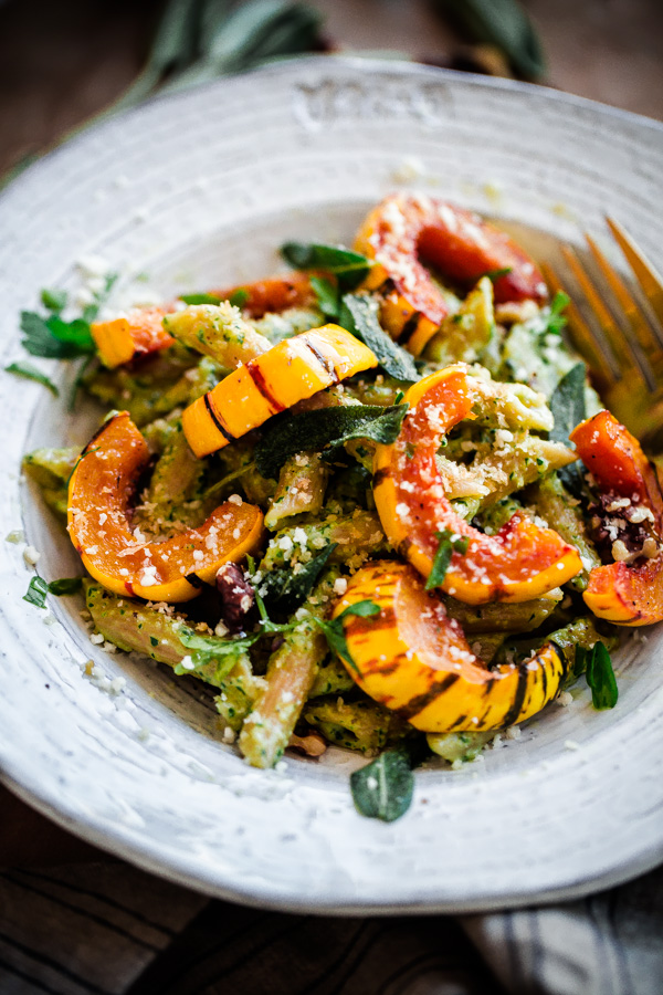 Whole Wheat Pasta with Walnut-Sage Pesto and Roasted Delicata Squash. A delicious, healthy, and EASY fall vegetarian pasta recipe!