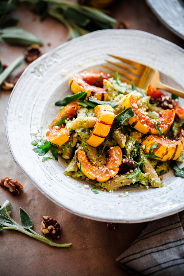 Whole Wheat Pasta with Walnut-Sage Pesto and Roasted Delicata Squash. A delicious, healthy, and EASY fall vegetarian pasta recipe!