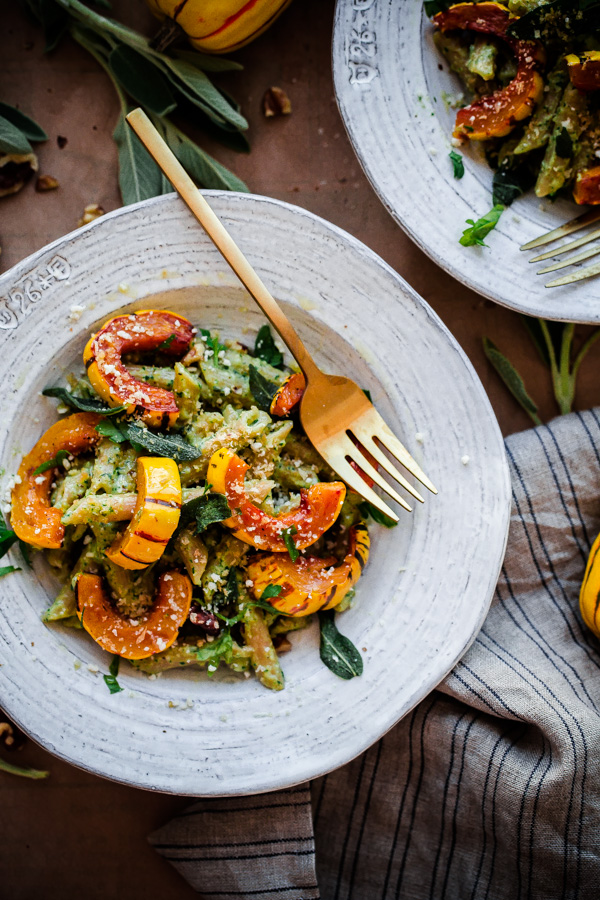 Whole Wheat Pasta with Walnut-Sage Pesto and Roasted Delicata Squash. A delicious, healthy, and EASY fall vegetarian pasta recipe!