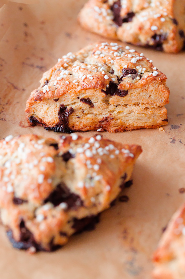 Orange chocolate chunk scones topped with a fresh orange glaze - this flaky cream scone recipe can be prepared in just over 30 minutes, or baked ahead of time!