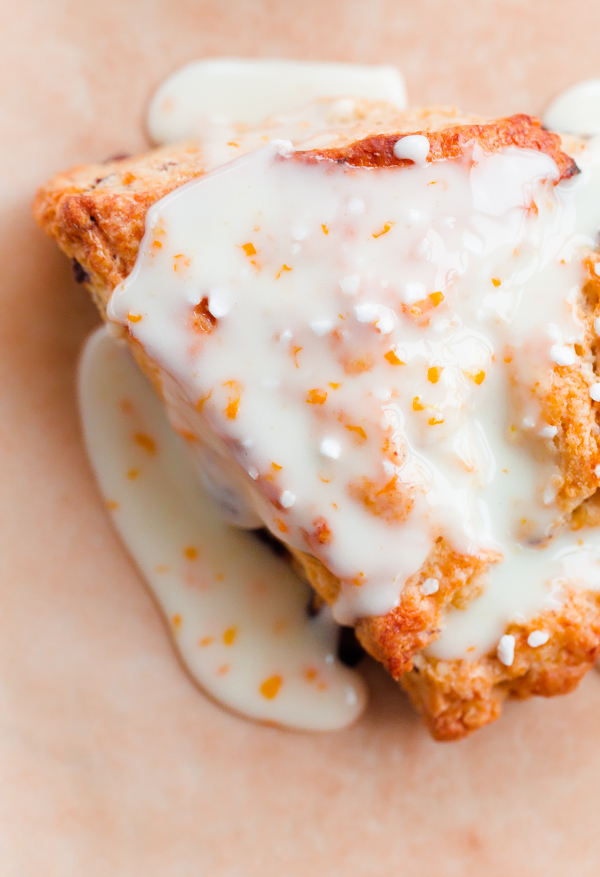 Orange chocolate chunk scones topped with a fresh orange glaze - this flaky cream scone recipe can be prepared in just over 30 minutes, or baked ahead of time!