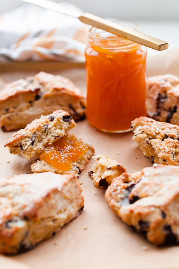 Orange chocolate chunk scones topped with a fresh orange glaze - this flaky cream scone recipe can be prepared in just over 30 minutes, or baked ahead of time!