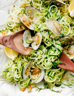 Zucchini Linguini with Garlic Clam Sauce. An EASY, healthy dinner recipe made with zucchini noodles. Less than 250 calories per serving!