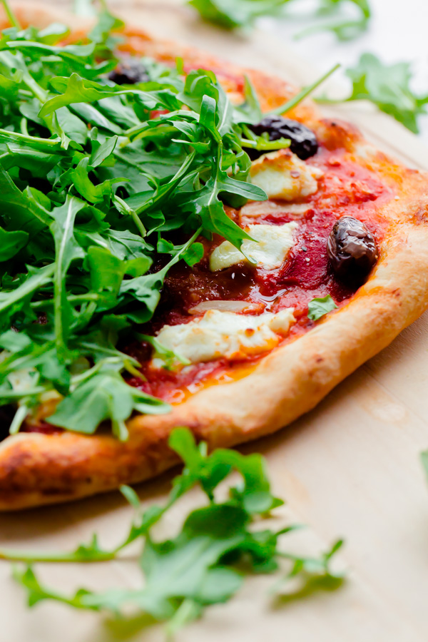 Spicy Red Pepper, Goat Cheese, Olive, and Arugula Pizza