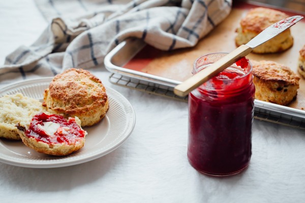 These Irish Soda Bread Scones are fluffy, lightly sweetened, filled with plump golden raisins, and pair perfectly with some butter and jam!