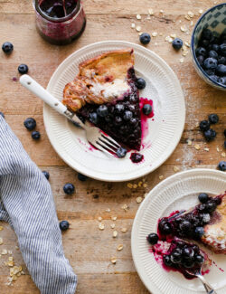 Gluten Free Dutch Baby with Blueberry Maple Syrup. This easy Dutch baby recipe is 100% whole grain and made with gluten free rolled oats!