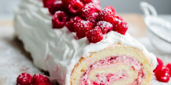Raspberry Roll Cake. Vanilla sponge cake filled with fresh raspberries and whipped cream!