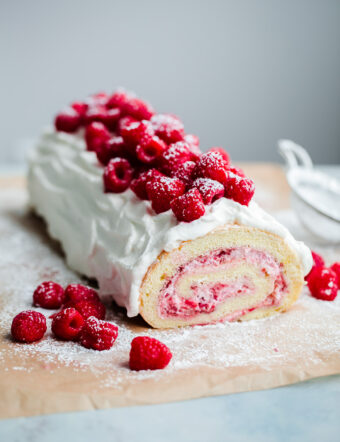 Raspberry Roll Cake. Vanilla sponge cake filled with fresh raspberries and whipped cream!
