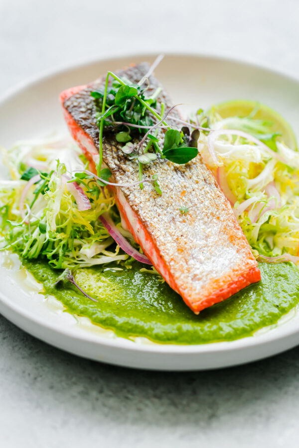 Crispy seared sockeye salmon with green chile adobo sauce and a simple frisée salad. This elegant, healthy main course can be prepared in less than 45 minutes! 