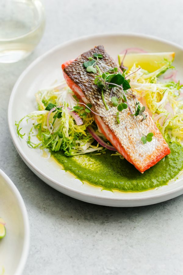Crispy seared sockeye salmon with green chile adobo sauce and a simple frisée salad. This elegant, healthy main course can be prepared in less than 45 minutes! 