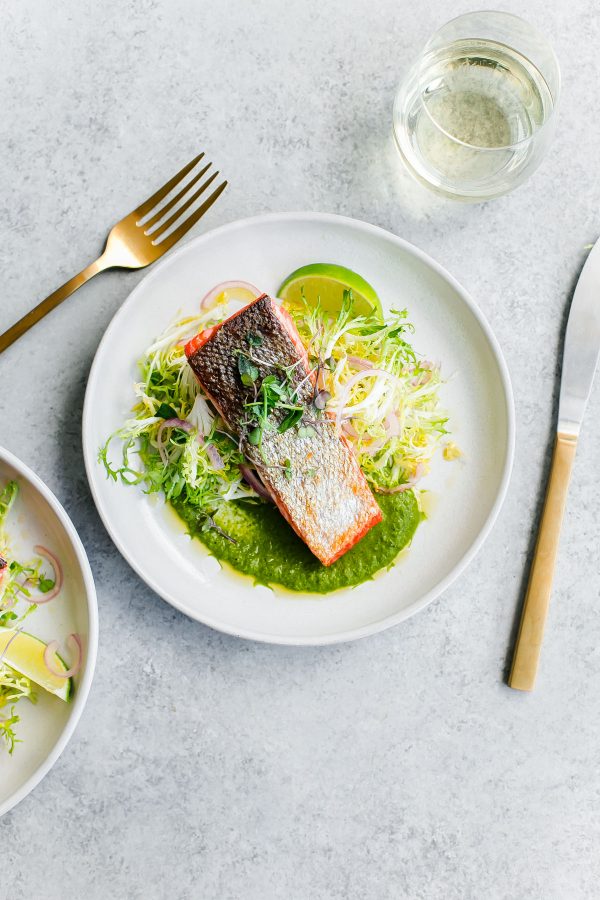 Crispy seared sockeye salmon with green chile adobo sauce and a simple frisée salad. This elegant, healthy main course can be prepared in less than 45 minutes! 