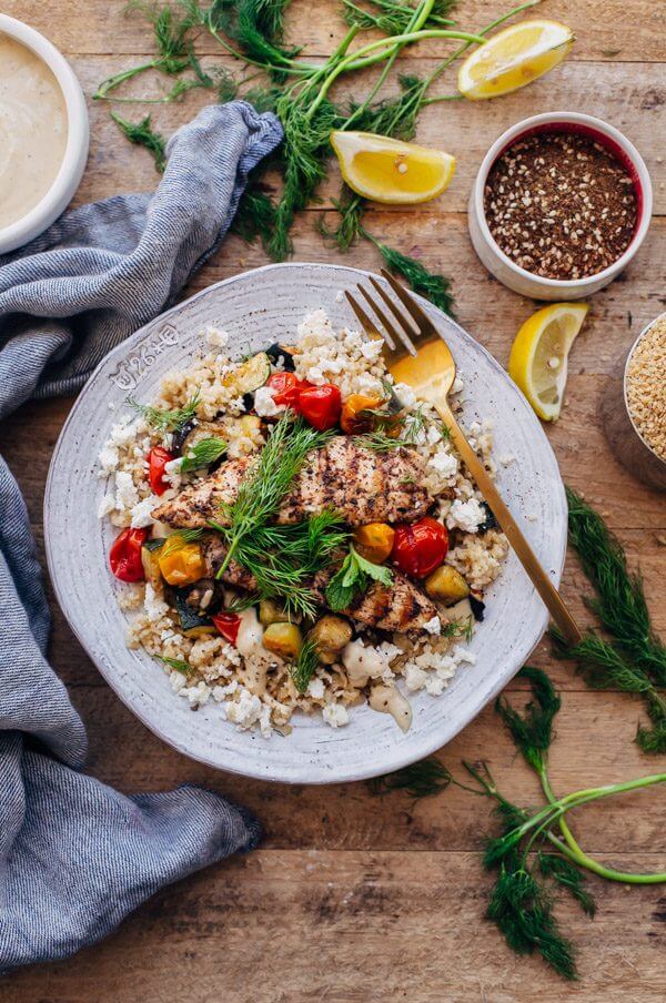 Za'atar Grilled Chicken Bulgur Bowls with Tahini Sauce - grilled chicken is paired with bulgur, roasted vegetables, feta cheese, and tahini sauce in this healthy main course. 