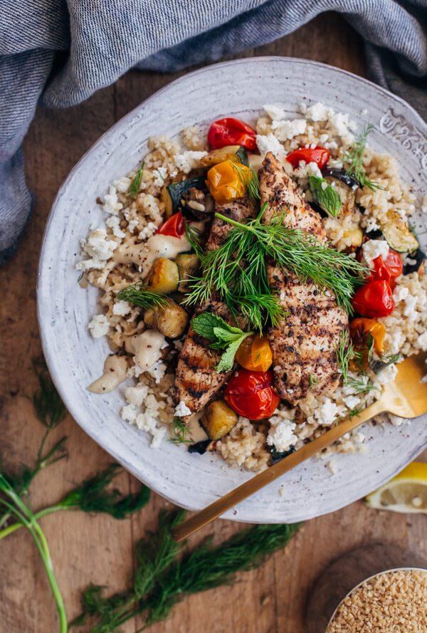 Za'atar Grilled Chicken Bulgur Bowls with Tahini Sauce - grilled chicken is paired with bulgur, roasted vegetables, feta cheese, and tahini sauce in this healthy main course. 