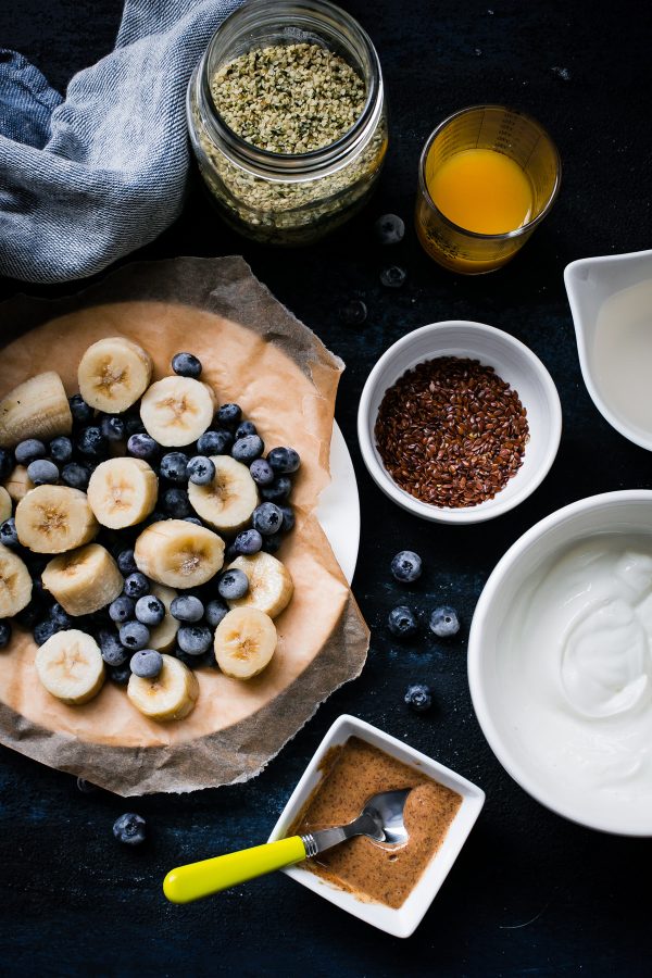 Simple Berry Smoothie - a healthy, vibrant smoothie made with frozen blueberries, greek yogurt, coconut water, banana, and my favorite smoothie ingredient: almond butter. 