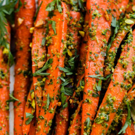 Roasted Carrots with Carrot Top-Pistachio Pesto. This delicious vegan side dish is packed with flavor!