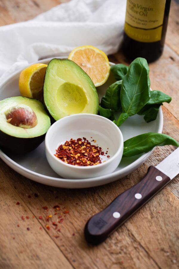 Fancy Avocado Toast - chunky avocado with lemon, chili flakes, basil - topped with a soft boiled egg!