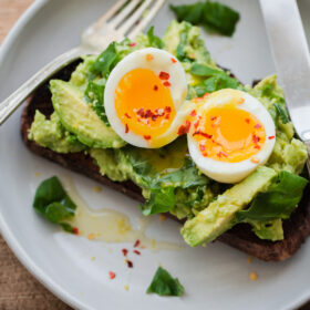 Fancy Avocado Toast - chunky avocado with lemon, chili flakes, basil - topped with a soft boiled egg!