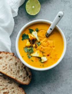 Roasted Cauliflower Soup with Coconut and Turmeric. This healthy cauliflower soup is flavored with Thai chili paste and coconut milk!