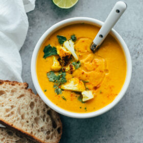 Roasted Cauliflower Soup with Coconut and Turmeric. This healthy cauliflower soup is flavored with Thai chili paste and coconut milk!