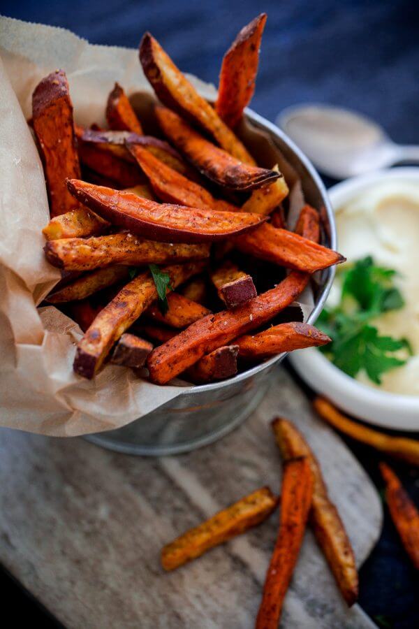 Crispy Baked Spiced Sweet Potato Fries with Garlic Aioli. A comforting fall appetizer or snack!