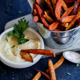 Crispy Baked Spiced Sweet Potato Fries with Garlic Aioli. A comforting fall appetizer or snack!