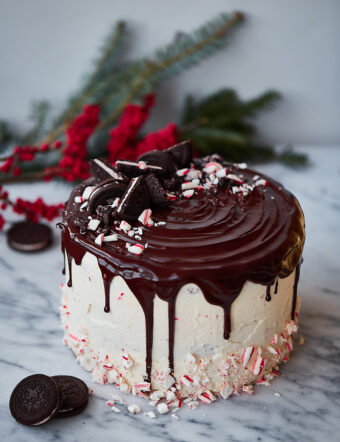 Candy Cane Crunch Cake. Peppermint chocolate layer cake filled with candy cane Swiss meringue buttercream and topped with peppermint ganache. Perfect celebration cake for the holidays!