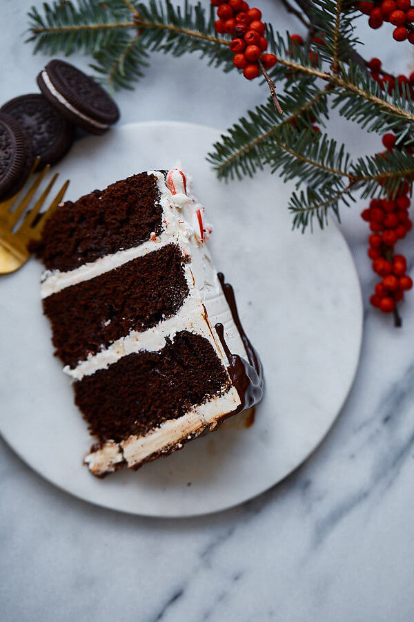 Candy Cane Crunch Cake. Peppermint chocolate layer cake filled with candy cane Swiss meringue buttercream and topped with peppermint ganache. Perfect celebration cake for the holidays!