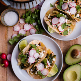 Salsa Verde Chicken Tacos. These easy chicken tacos are made with braised chicken thighs, poblano peppers, onions, and roasted tomatillo salsa!