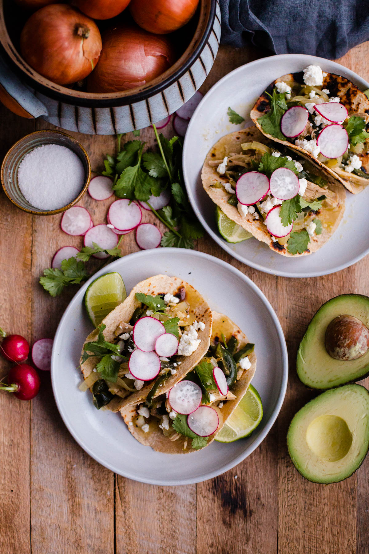 Salsa Verde Chicken Tacos. These easy chicken tacos are made with braised chicken thighs, poblano peppers, onions, and roasted tomatillo salsa!