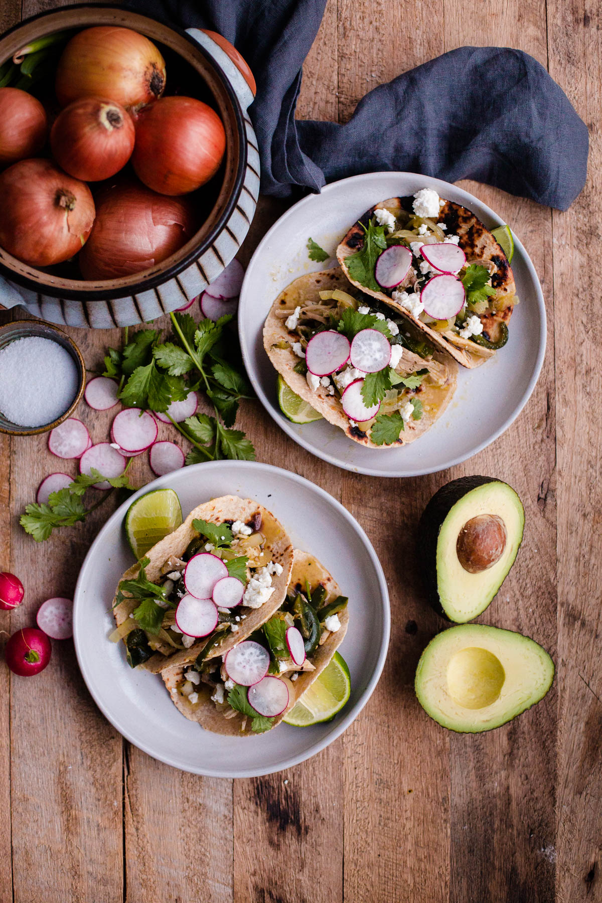 Salsa Verde Chicken Tacos. These easy chicken tacos are made with braised chicken thighs, poblano peppers, onions, and roasted tomatillo salsa!