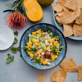 Tropical Mango Guacamole. Traditional guacamole is given a tropical twist with juicy mango and jicama! Perfect appetizer for Cinco de Mayo.