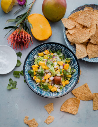 Tropical Mango Guacamole. Traditional guacamole is given a tropical twist with juicy mango and jicama! Perfect appetizer for Cinco de Mayo.