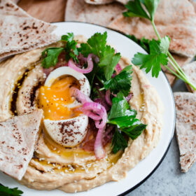 Hummus with Soft Boiled Egg, Pickled Onion, Parsley, and Sumac Oil