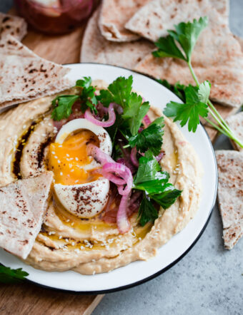 Hummus with Soft Boiled Egg, Pickled Onion, Parsley, and Sumac Oil