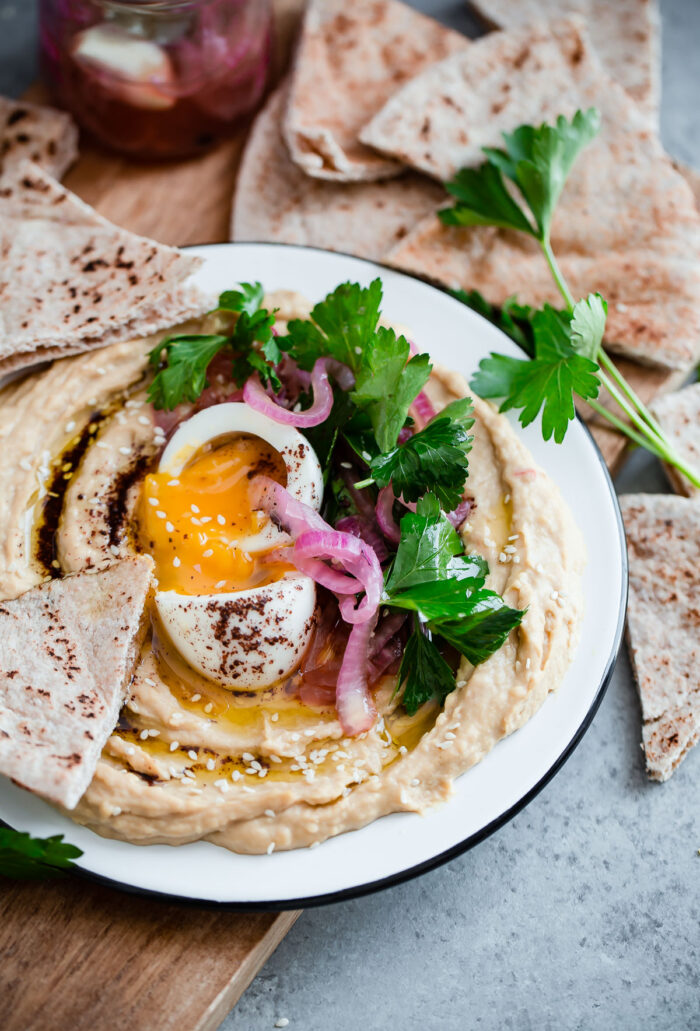 Hummus with Soft Boiled Egg, Pickled Onion, Parsley, and Sumac Oil