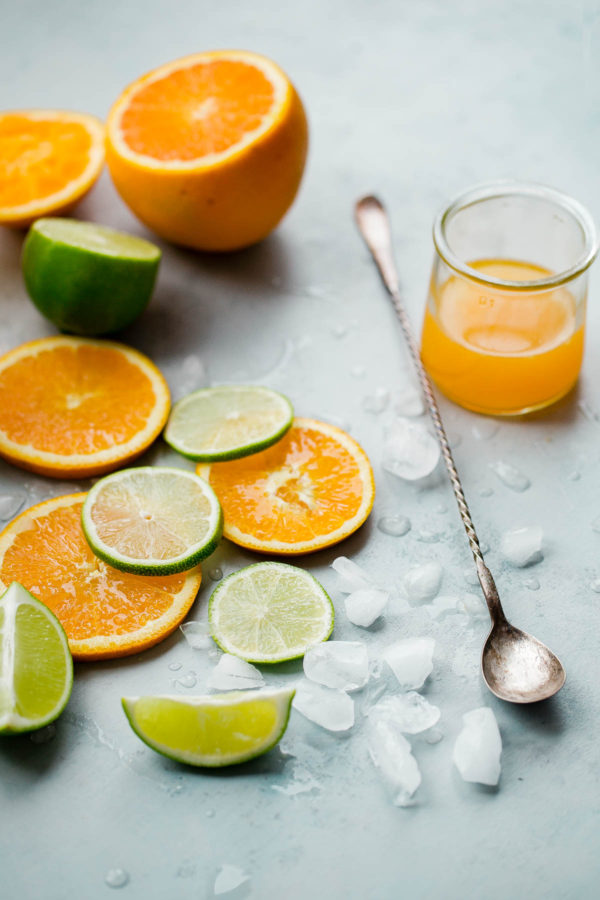 Sliced Oranges and Lime Pieces with Ice
