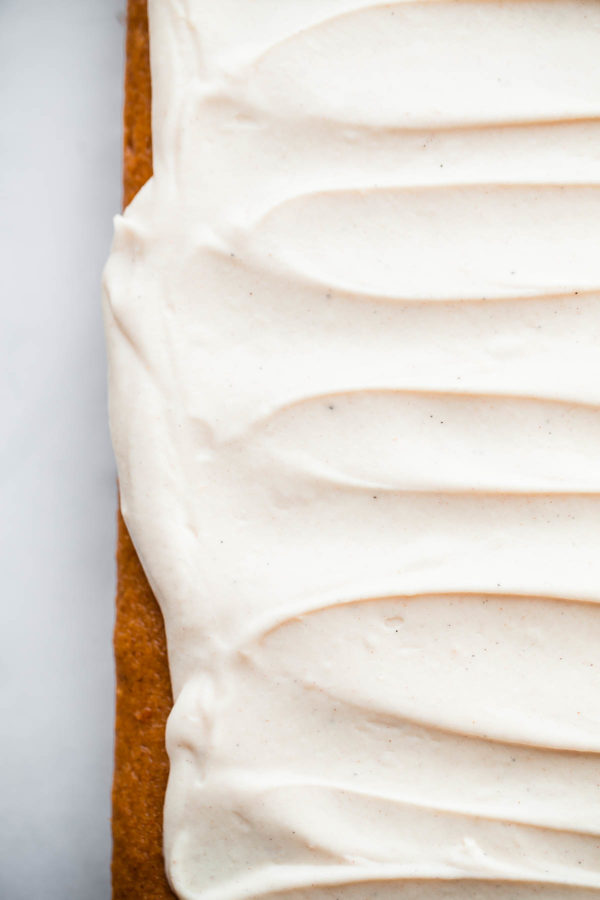 Pumpkin Sheet Cake. A RICH, decadent pumpkin cake topped with spiced cream cheese frosting!